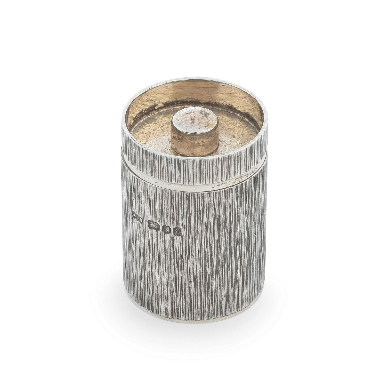 GERALD BENNEY: a small silver pepper mill London 1978, incuse stamped GERALD BENNEY LONDON: GERALD BENNEY: a small silver pepper mill London 1978, incuse stamped GERALD BENNEY LONDON Cylindrical form, twist mechanism, with bark effect textured sides, height 4cm, diameter 3cm, weight total 3
