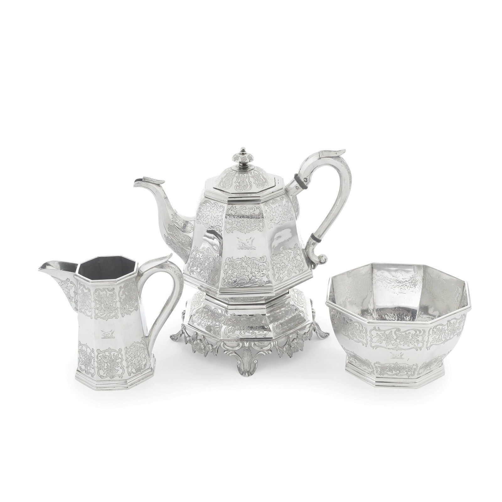 An American three-piece silver tea service Andrew Ellicott Warner, Baltimore circa 1840, stamped...: An American three-piece silver tea service Andrew Ellicott Warner, Baltimore circa 1840, stamped A.E.WARNER in serrated rectangle and 11 in small rectangle All tapering octagonal form, comprising a t