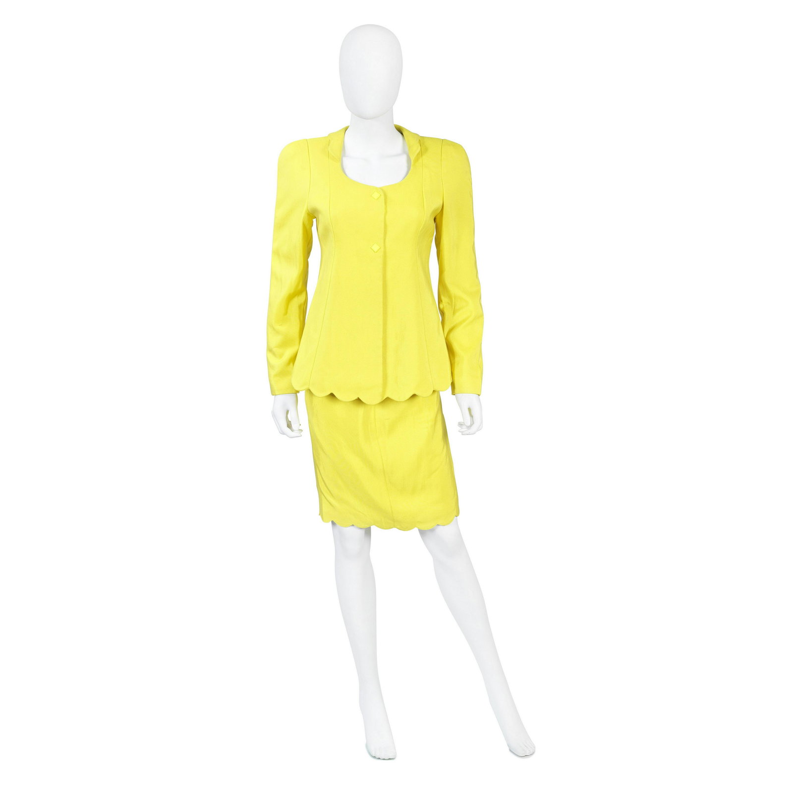 Shingai Shoniwa / Thierry Mugler A Canary Yellow Two-Piece Skirt Suit, 1990s 2: Shingai Shoniwa / Thierry Mugler A Canary Yellow Two-Piece Skirt Suit, 1990s bright wool/nylon mix with scalloped trim, the jacket with popper fastenings, as worn by Shingai at V Festival, 2011 Labell