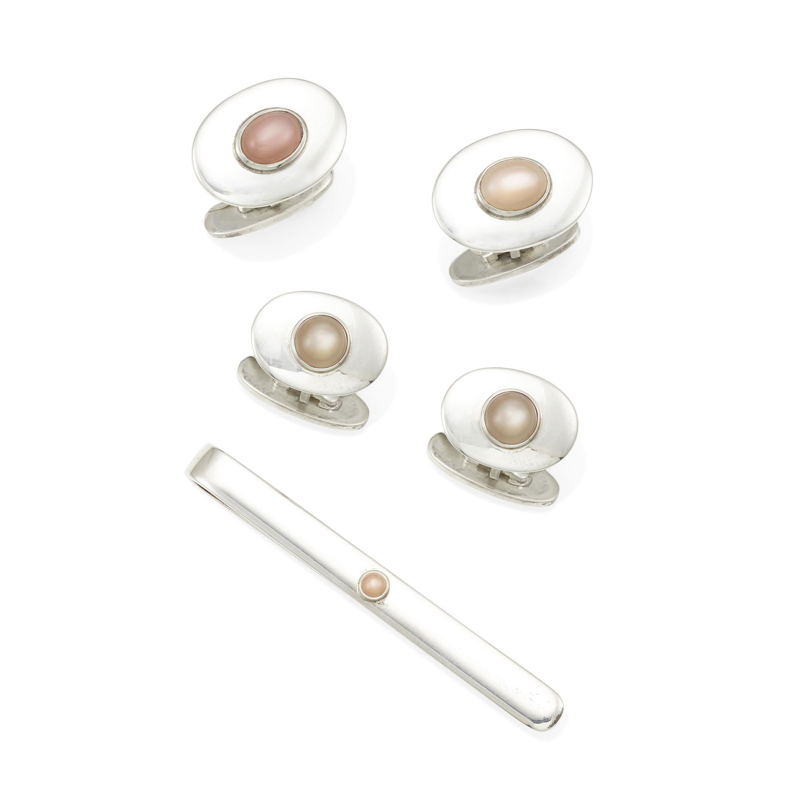 ANDREAS MIKKELSEN FOR GEORG JENSEN: A GROUP OF SILVER AND PEACH MOONSTONE JEWELRY: ANDREAS MIKKELSEN FOR GEORG JENSEN: A GROUP OF SILVER AND PEACH MOONSTONE JEWELRY Two pairs of high polish silver cufflinks set with oval and round peach moonstone cabochons together with a matching t