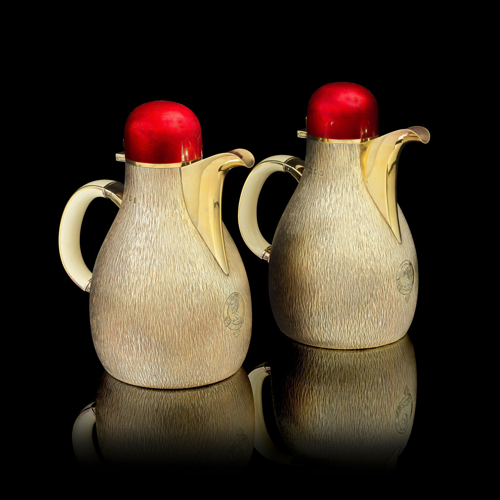 GERALD BENNEY: a rare pair of silver-gilt and enamelled pitchers London 1973, the bases with mas...: GERALD BENNEY: a rare pair of silver-gilt and enamelled pitchers London 1973, the bases with master enamellers mark AAE in an oval punch, for Alan Alfred Evans, stamped GERALD BENNEY LONDON, Transluce