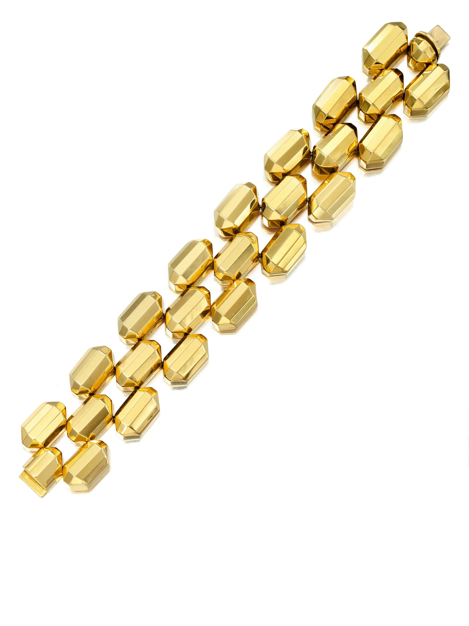 AN 18K GOLD BRACELET, ITALY: AN 18K GOLD BRACELET, ITALY Comprising three rows of geometric links; with Italian assay marks; gross weight approximately 76.8 grams; length 7½ in.