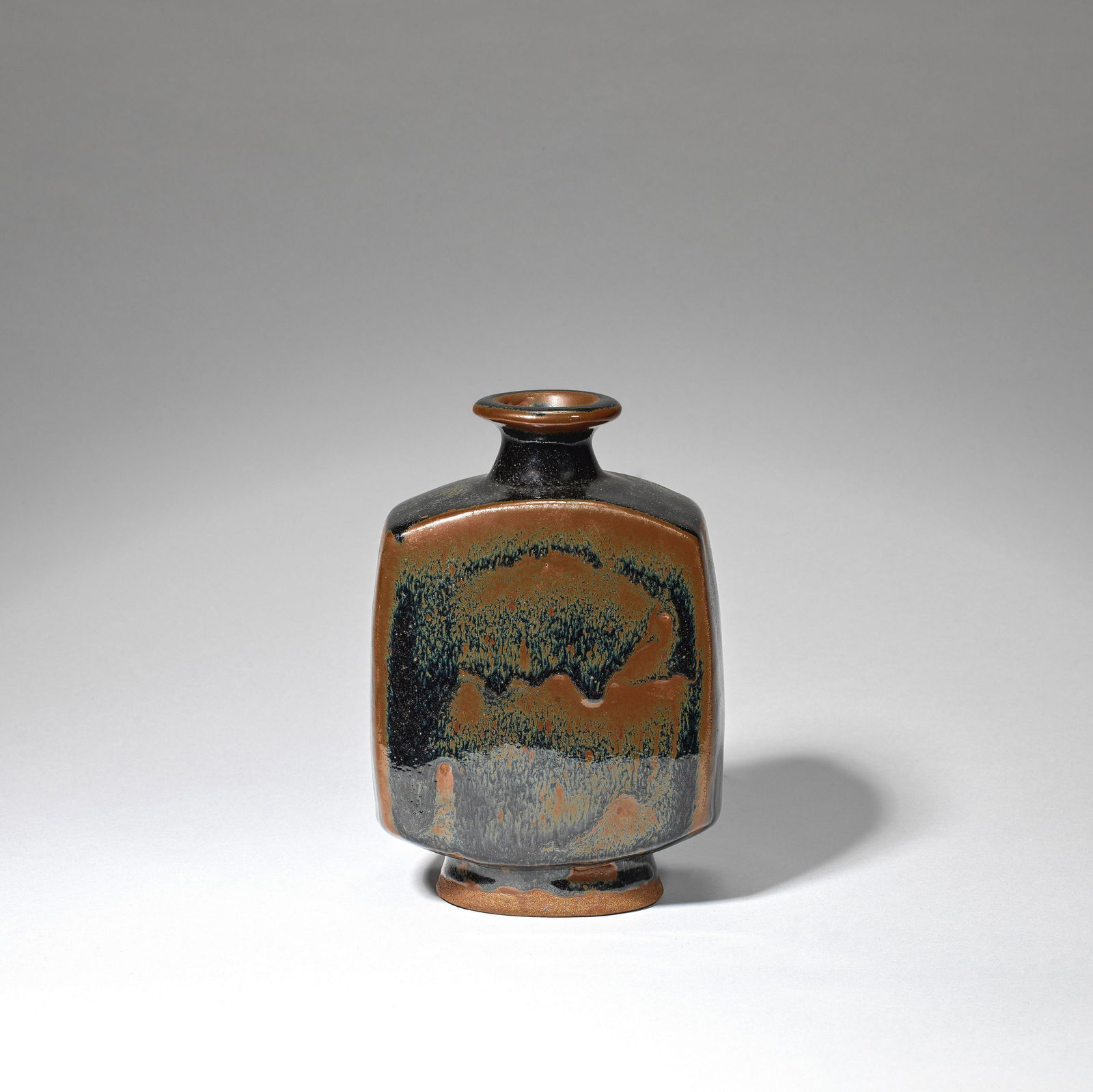Bernard Leach Bottle vase, circa 1960: Bernard Leach Bottle vase, circa 1960 Stoneware, tenmoku and iron glazes with willow design. 19.5cm high Impressed with artist's and Leach Pottery seals. Footnotes: Literature Tony Birks and Cornelia