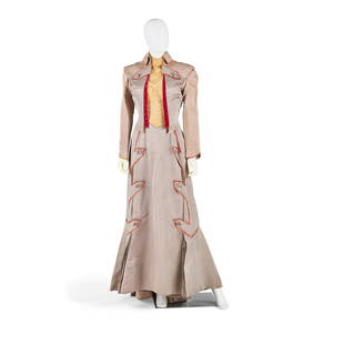 AN ANDREA KING COSTUME FROM THE BEAST WITH FIVE FINGERS: AN ANDREA KING COSTUME FROM THE BEAST WITH FIVE FINGERS Warner Bros., 1946. Designed by Travilla, a Victorian style two-piece costume in silver faille with fuchsia velvet trim, comprising a floor leng