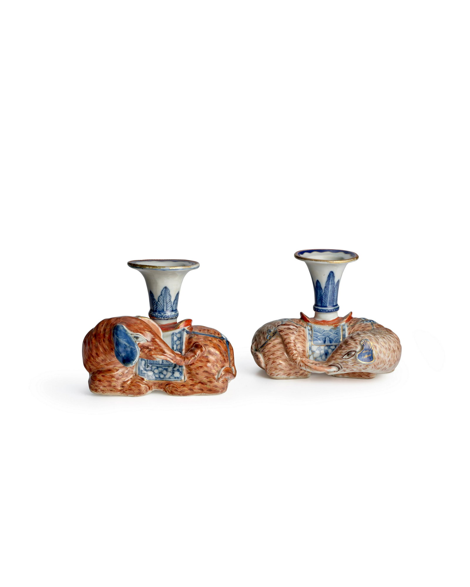A PAIR OF IRON-RED, SEPIA, BROWN, GILT AND UNDERGLAZE BLUE 'ELEPHANT' CANDLESTICKS Jiaqing perio... (1 of 3)