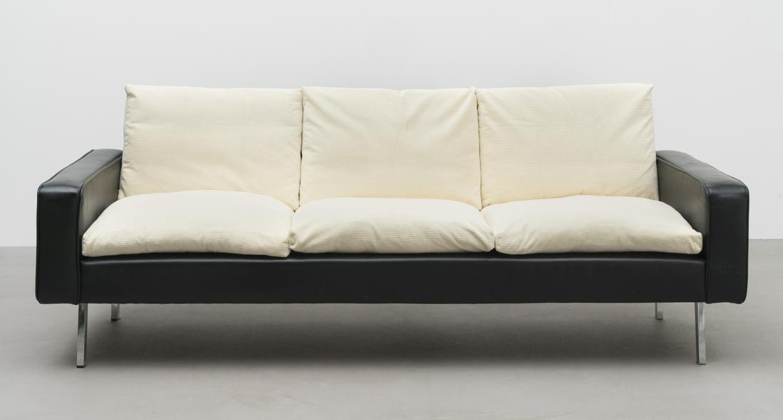 In the style of Robin Day Sofa, 20th century: In the style of Robin Day Sofa, 20th century Leather and fabric upholstery, chromium-plated steel. 68 cm high, 195 cm wide, 79 cm deep This lot is subject to the following lot symbols: TP T