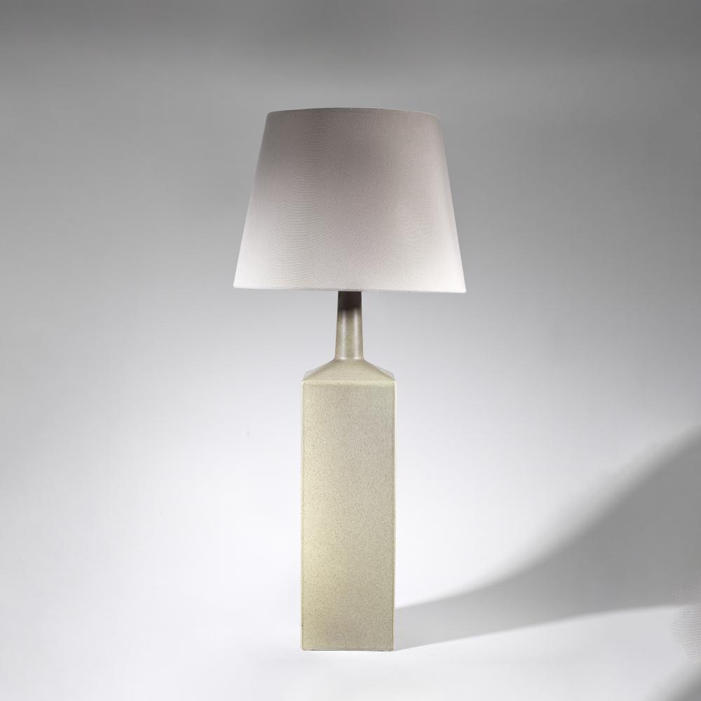Le Klint Floor lamp, model no. 357, 1960s: Le Klint Floor lamp, model no. 357, 1960s Glazed stoneware, fabric shade. 94.5 cm high Produced by Le Klint, Copenhagen, Denmark. Underside signed 'LE KLINT'. This lot is subject to the following lot