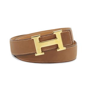 Herm&#232;s: a Barenia Leather Reversible Constance H Belt 1999 (includes small dust bag and box): Herm&#232;s: a Barenia Leather Reversible Constance H Belt 1999 Fauve Barenia to one side and natural sable to the other, gold H buckle Condition Grade B Size 85, 3cm wide, includes small dust bag and