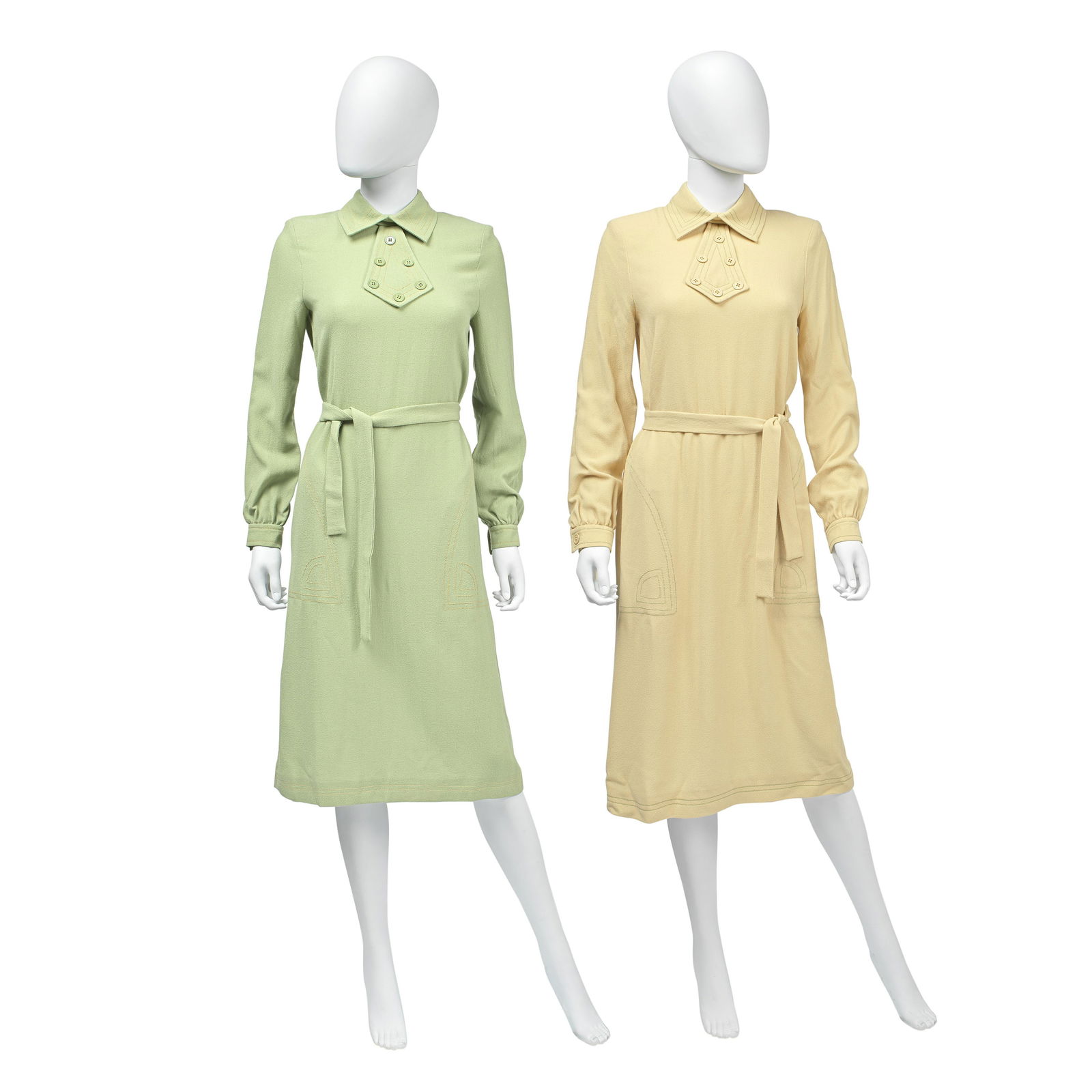 Jean Varon (British, 1938-2022) Two Crepe Wool Dresses, 1970s: Jean Varon (British, 1938-2022) Two Crepe Wool Dresses, 1970s matching buttoned shift dress design with belted waists, the first in cream, labelled size 12, 32in/82cm chest, the second in sage green,