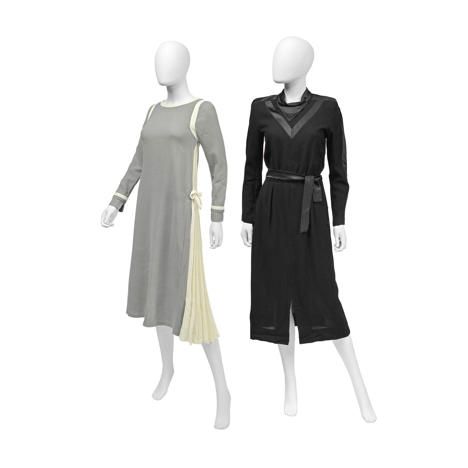 Jean Varon (British, 1938-2022) Two Crepe Wool Dresses, 1970s: Jean Varon (British, 1938-2022) Two Crepe Wool Dresses, 1970s the first in grey with cream knife-edge pleated side panels, labelled size 10, 30in/80cm chest, the second with black satin trim and trian
