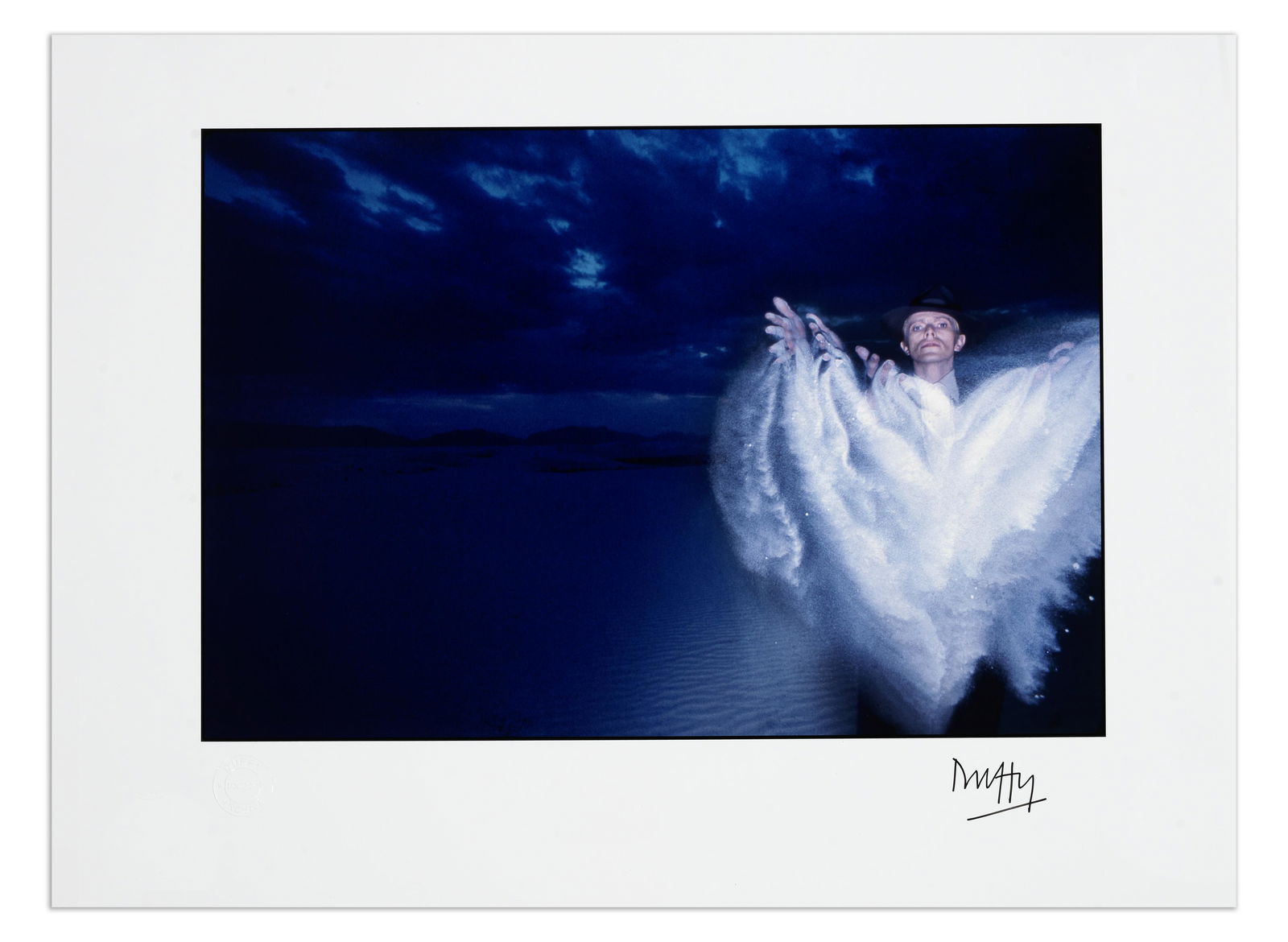 Brian Duffy (British, 1933-2010) David Bowie, Thin White Duke #4 – White Sands, New Mexico...: Brian Duffy (British, 1933-2010) David Bowie, Thin White Duke #4 – White Sands, New Mexico, 1975, printed later No.4/12, archival pigment print, signed in black ink by the photographer to the lo