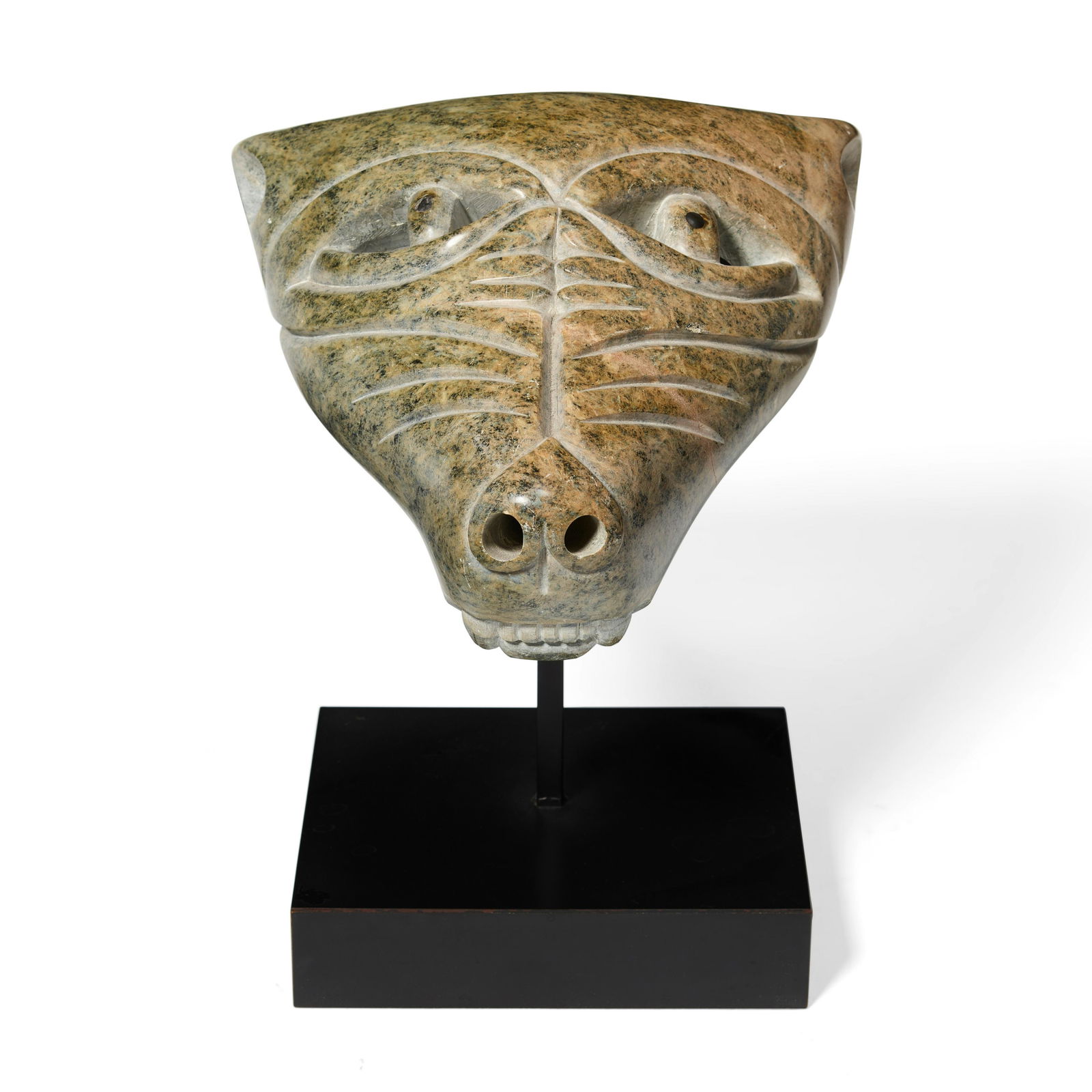 An Abraham Anghik Ruben sculpture, 1991: Abraham Anghik Ruben Inuit, Paulatuk, (b. 1951), wolf mask, 1991, a carved stone sculpture, raised on fitted stand, dated and signed in Roman: Anghik. length 9 1/2in, width 9in Footnotes: Provenance P