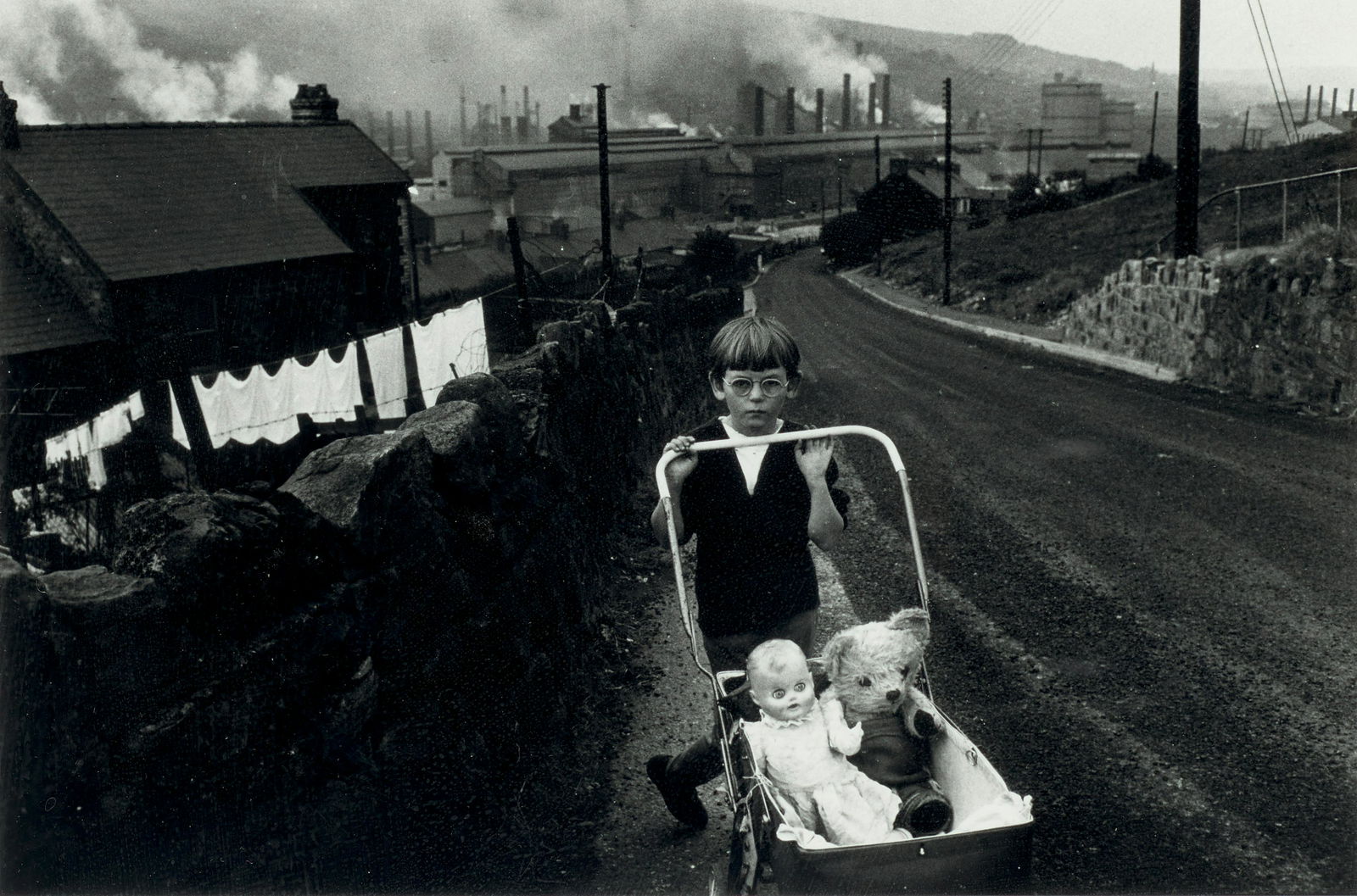 Bruce Davidson (born 1933); Welsh Boy with Stroller;: Bruce Davidson (born 1933) Welsh Boy with Stroller, 1965 Gelatin silver print; signed, dated and annotated 'S. Wales' in pencil on the verso. 6 x 9 in. (15.2 x 22.9 cm.) sheet 11 x 14 in. (28 x 35.6 c