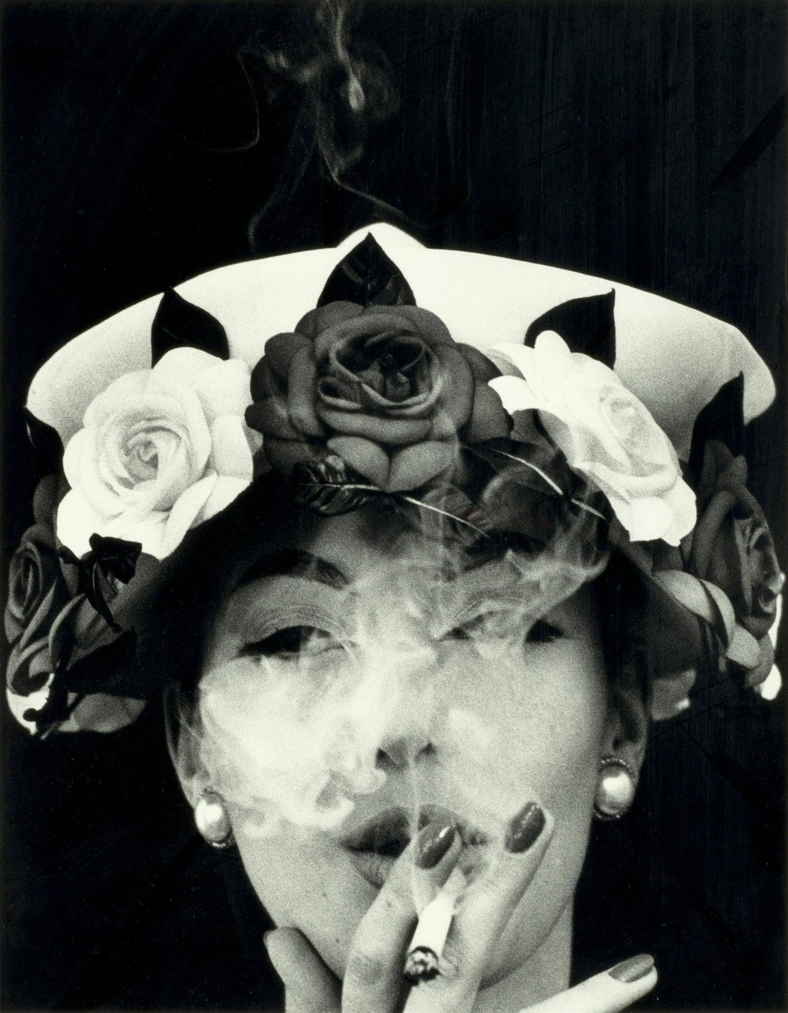 William Klein (1928-2022); Hat + 5 Roses, Paris (Vogue);: William Klein (1928-2022) Hat + 5 Roses, Paris (Vogue), 1956 Gelatin silver print, printed later; signed, titled, and dated in pencil on the verso. 17 3/4 x 14 in. (45.1 x 35.6 cm.) sheet 19 5/8 x 15