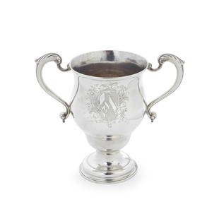 An early George III silver two-handled cup William Grundy, London 1764: An early George III silver two-handled cup William Grundy, London 1764 Inverted and waisted pear shape, with leaf-capped scroll handles either side of a plain polished body, the front with an engrave