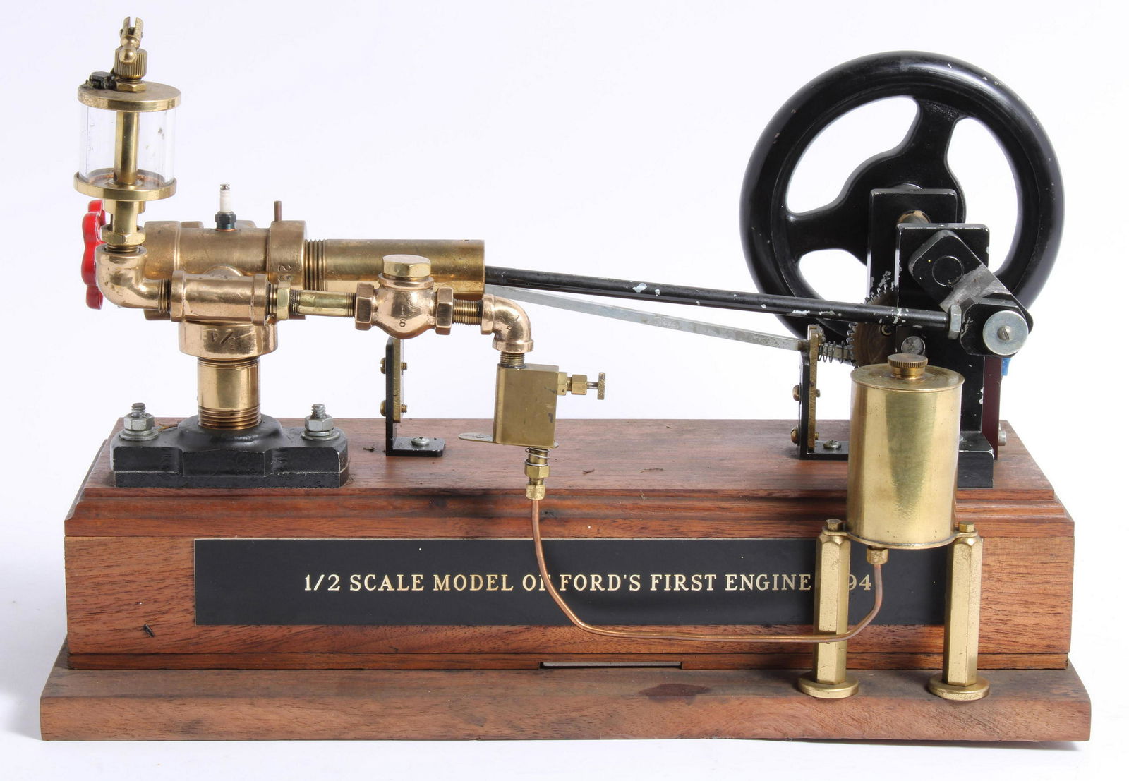 A 1:2 scale working model of Ford's First engine 1894,: A 1:2 scale working model of Ford's First engine 1894, mounted on a wooden base, (condition untested). Lot to be sold without reserve. Buyer's Premium Notice:For AUTOMOBILIA and other non-motor vehicl