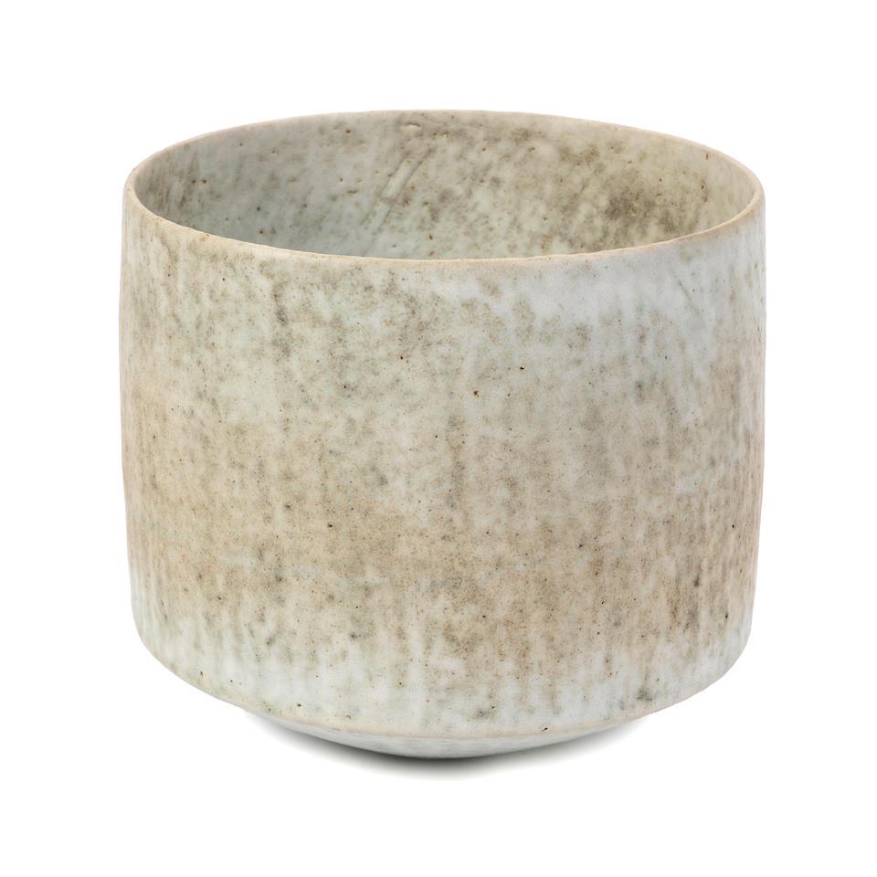 John Ward High-sided vessel, circa 1985: John Ward High-sided vessel, circa 1985 Stoneware, mottled white, green and grey glazes over a lightly textured surface. 19 cm high, 21.5 cm diameter Underside with impressed artist's signature. This