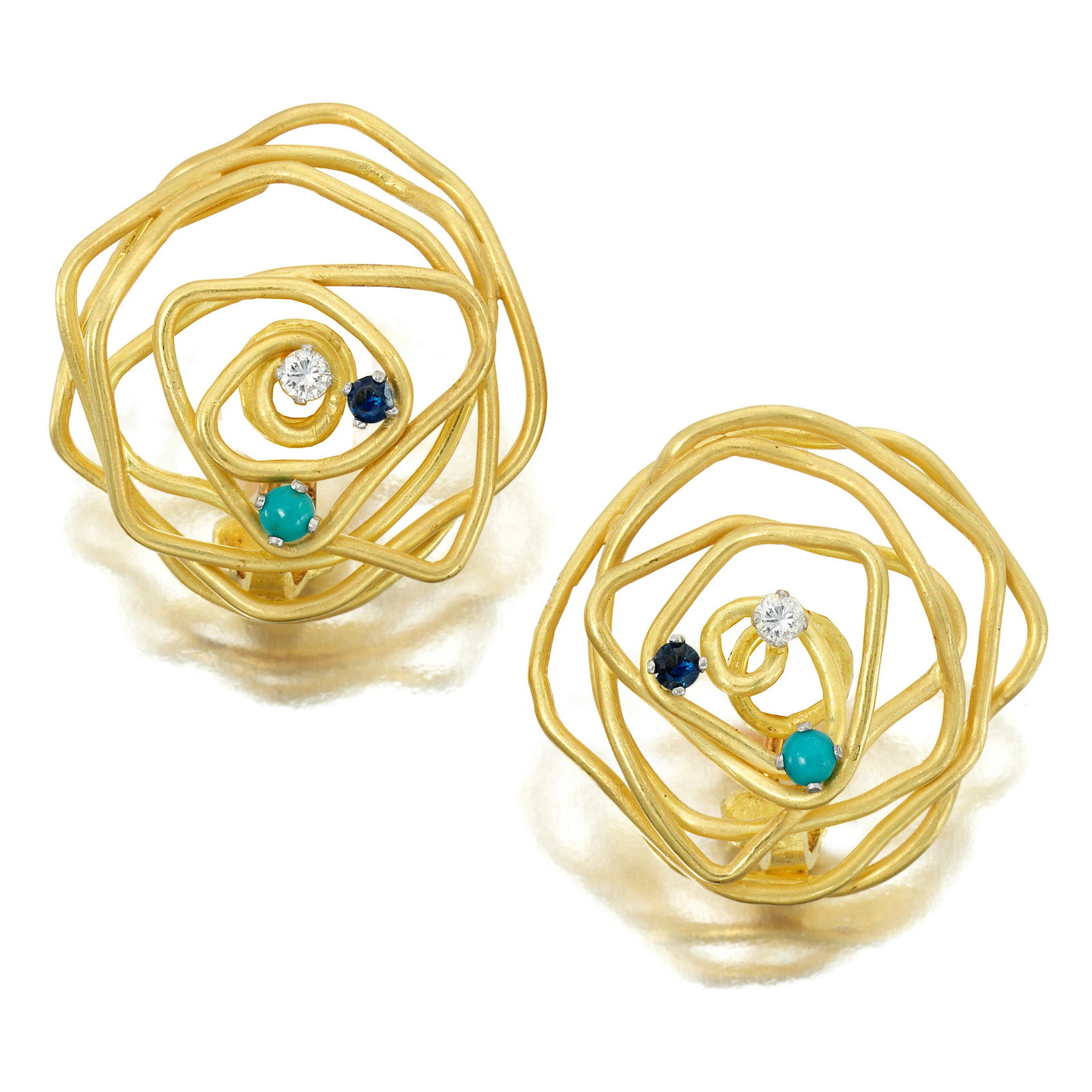 GRIMA: A PAIR OF 18K GOLD AND GEM-SET EARCLIPS, 1979: GRIMA: A PAIR OF 18K GOLD AND GEM-SET EARCLIPS, 1979 Of circular design comprising gold wire accented by round diamonds, sapphires and cabochon turquoise; signed Grima; maker's mark AGLtd; UK hallmark