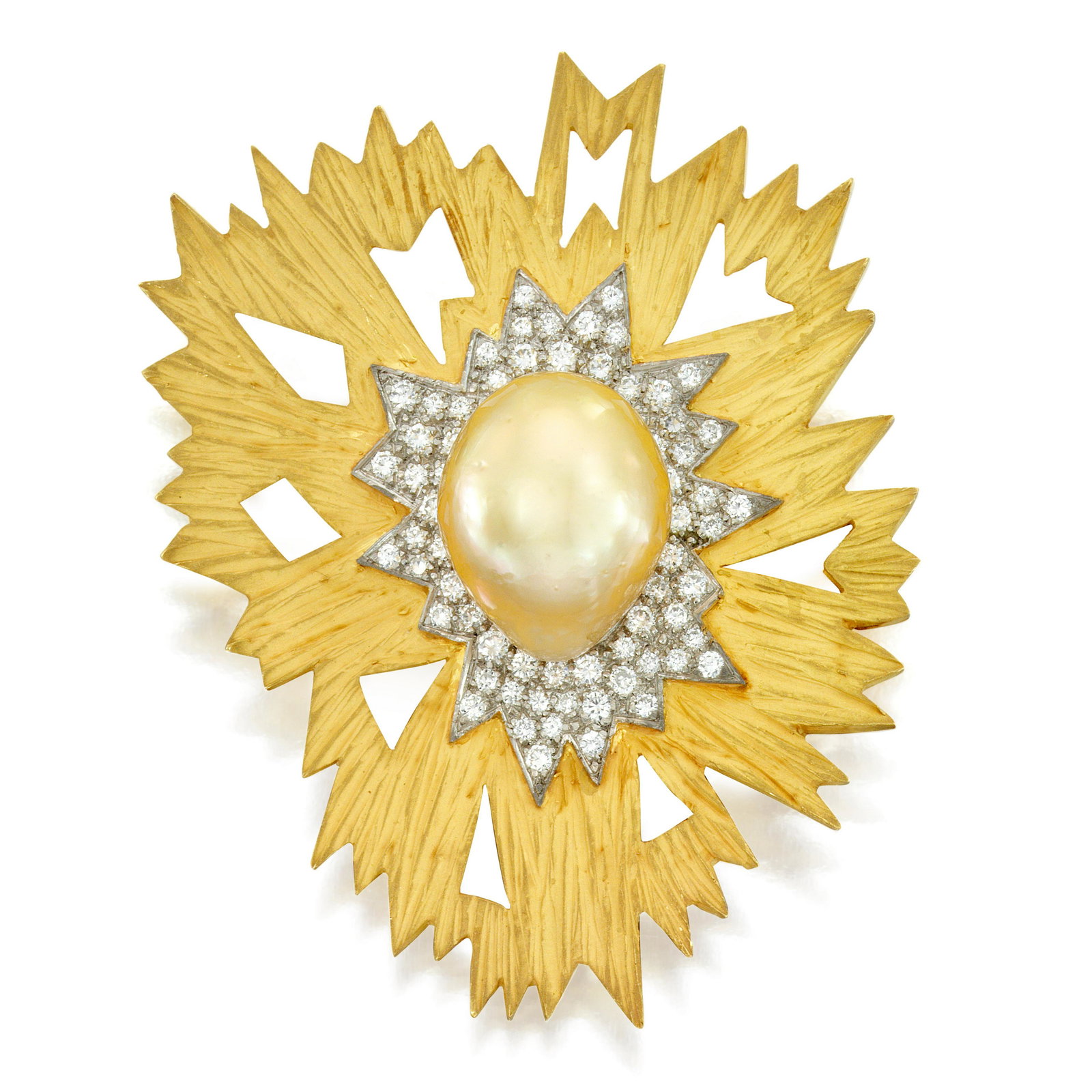 GRIMA: AN 18K GOLD, CULTURED PEARL AND DIAMOND BROOCH, CIRCA 1986: GRIMA: AN 18K GOLD, CULTURED PEARL AND DIAMOND BROOCH, CIRCA 1986 Of starburst shaped with textured and sandblasted gold, centering a cultured pearl of yellow-tint, framed by round diamonds; signed Gr