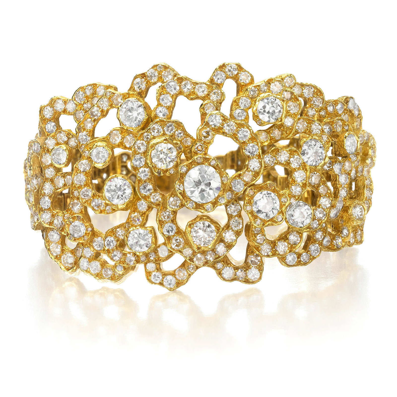 GRIMA: A DIAMOND BRACELET, 1967: GRIMA: A DIAMOND BRACELET, 1967 Of openwork floral design centering an old European-cut diamond weighing approximately 1.00 carat, accented with old European-cut, round and single-cut diamonds; signe