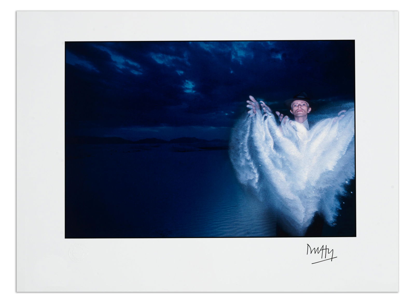 Brian Duffy (British, 1933-2010): David Bowie, Thin White Duke #4 – White Sands, New Mexic...: Brian Duffy (British, 1933-2010): David Bowie, Thin White Duke #4 – White Sands, New Mexico,1975, printed later,no.4/12, archival pigment print, signed in black ink by the photographer to the lo