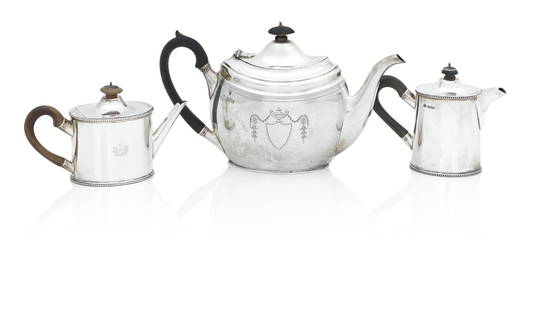 A GEORGIAN BATCHELOR'S SILVER TEAPOT AND TWO EDWARDIAN SILVER TEAPOTS (3): A GEORGIAN BATCHELOR'S SILVER TEAPOT AND TWO EDWARDIAN SILVER TEAPOTS The first by Andrew Fogelberg & Stephen Gilbert, London, 1782, of oval form with beaded rims and fruitwood handle, engraved with