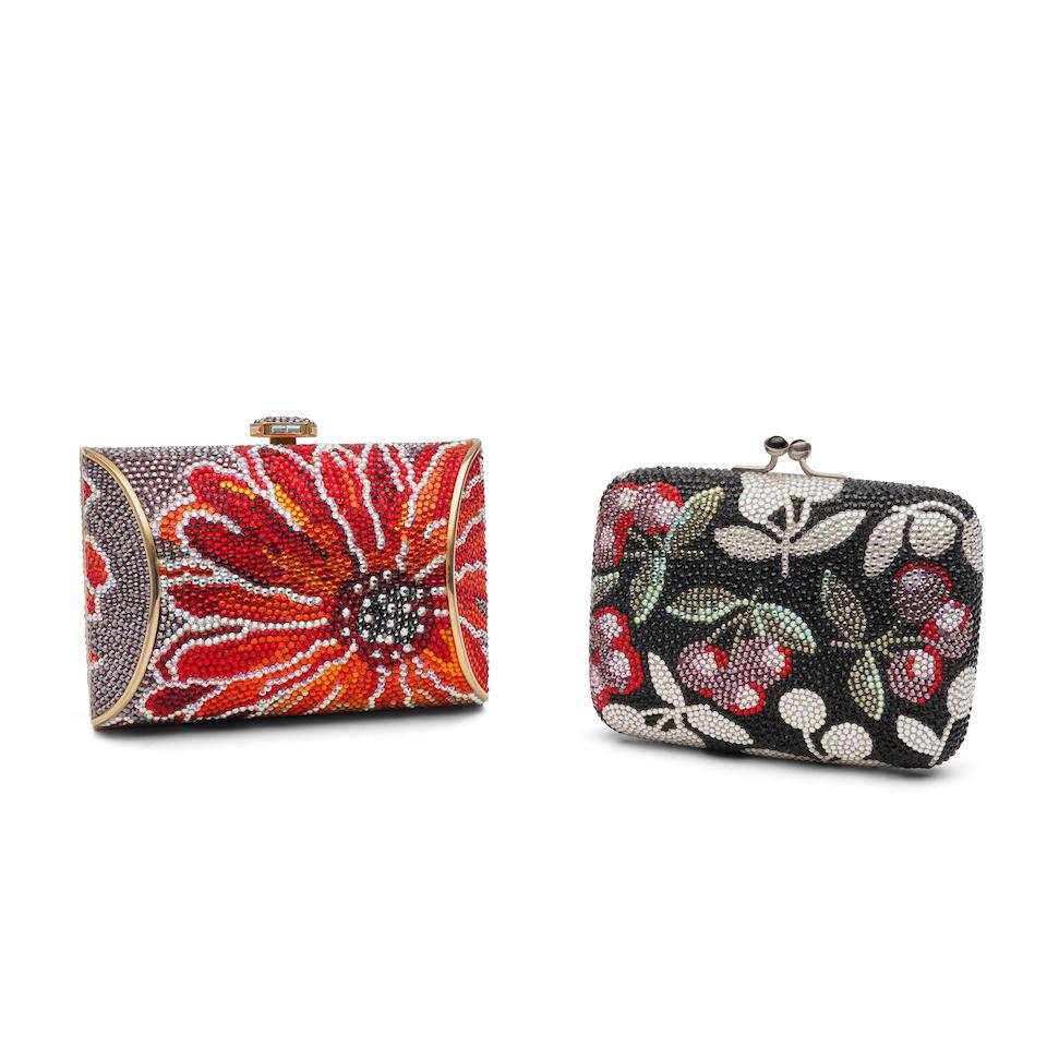 Two Judith Leiber Miniature Minaudieres: Two Judith Leiber Miniature Minaudieres One with an orange and red flower against a silver background; one with red, green, and silver cherries against a black background; 3 x 4 1/2 x 2 1/4 and 3 x 4