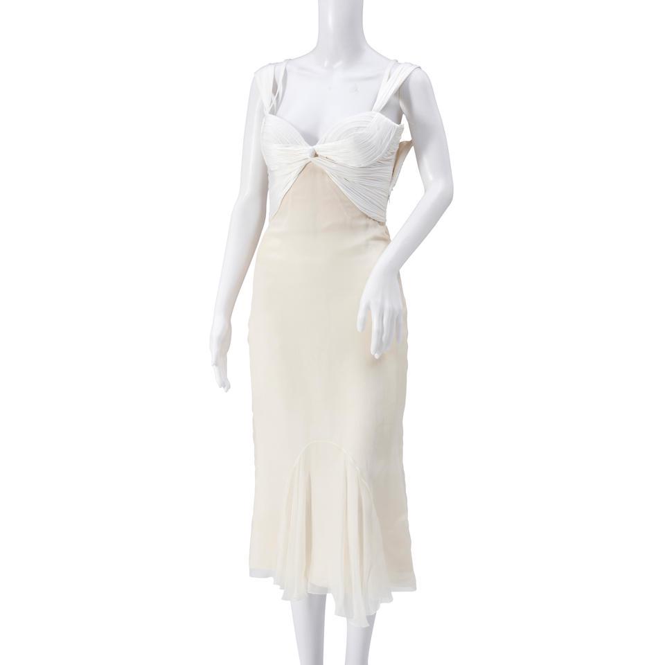 Versace White Polyester Cocktail Dress: Versace White Polyester Cocktail Dress The sleeveless dress with a ruched bodice; keyhole back; chiffon skirt; size 38. For further information on this lot please visit Bonhams.com