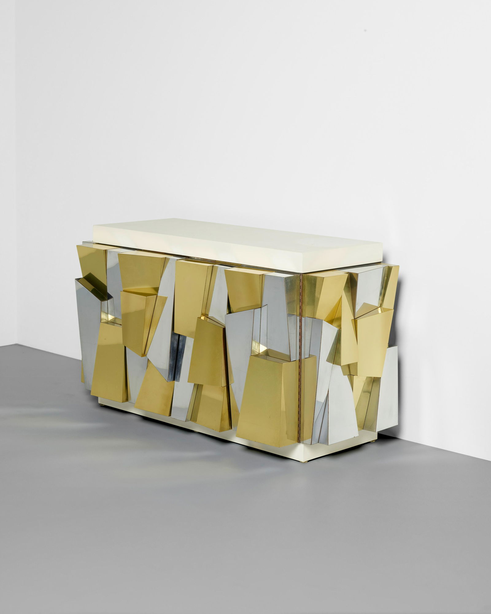 PAUL EVANS (1931-1987) Cityscape II Faceted Cabinetcirca 1975model no. PE354, Paul Evans for Dir...: PAUL EVANS (1931-1987) Cityscape II Faceted Cabinet circa 1975 model no. PE354, Paul Evans for Directional, brass, chrome-plated steel, lacquered wood height 32in (81cm); width 56in (142cm); depth 23i