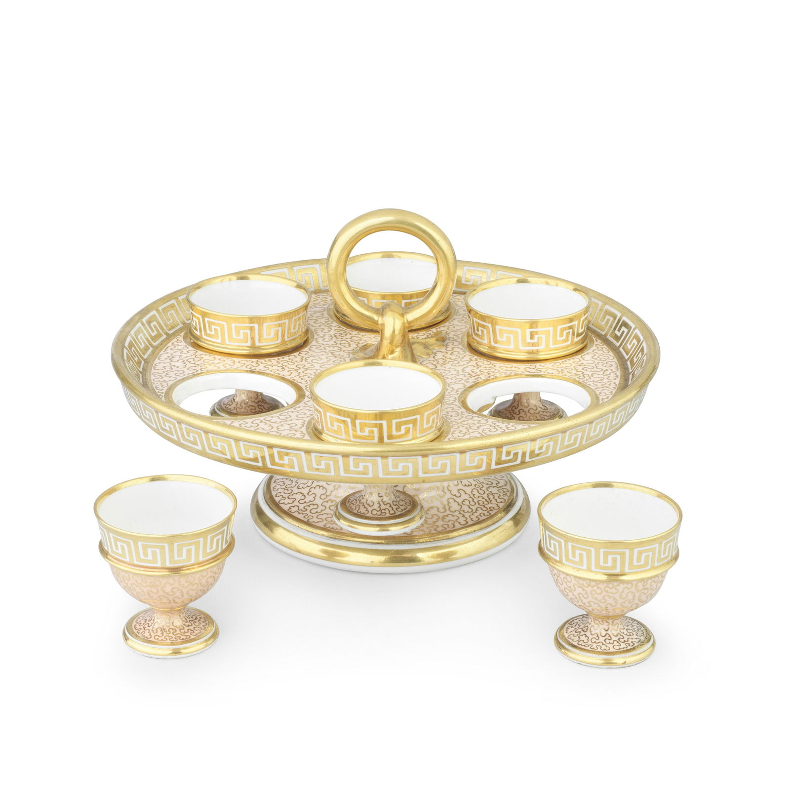 A Barr, Flight and Barr Worcester egg cup stand and six egg cups, circa 1810: A good Barr, Flight and Barr Worcester egg cup stand and six egg cups, circa 1810The circular footed tray with a raised central gilt ring handle, six circular holes each containing a single separate m