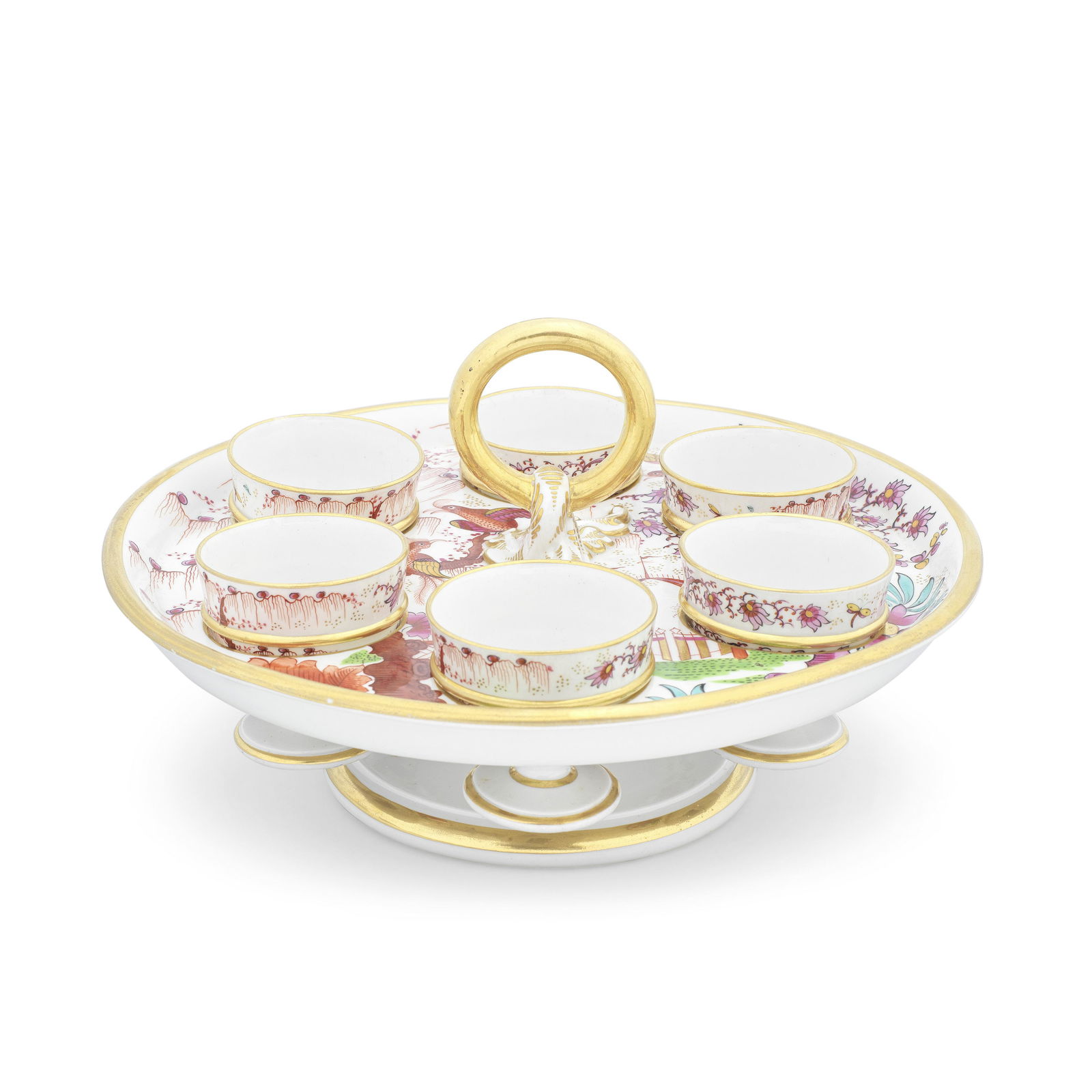 A remarkable Barr, Flight and Barr Worcester egg cup stand and six egg cups, circa 1810: A remarkable Barr, Flight and Barr Worcester egg cup stand and six egg cups, circa 1810The circular footed tray with a raised central ring handle, six circular holes each containing a single separate