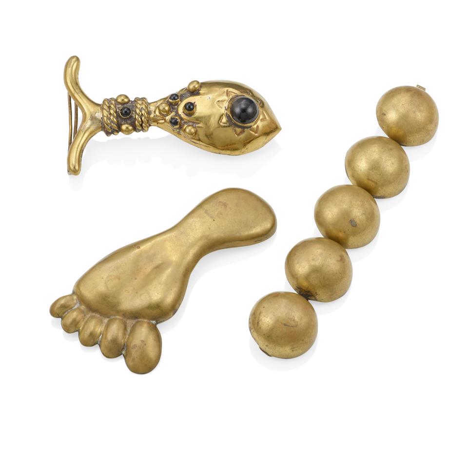 HUBERT HARMON: A GROUP OF BRASS AND ONYX JEWELRY: HUBERT HARMON: A GROUP OF BRASS AND ONYX JEWELRY A belt buckle of a fish accented with round onyx cabochons, together with a brooch designed as a foot and a bracelet of linked half-domes, signed with