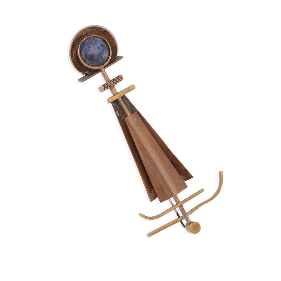 MACCHIARINI: A MIXED-METAL AND SODALITE BROOCH: MACCHIARINI: A MIXED-METAL AND SODALITE BROOCH Of an abstract and geometric design featuring a round sodalite cabochon, signed P. Macchiarini, measures 4 3/4 x 2 in. Footnotes: Literature: Illustrate
