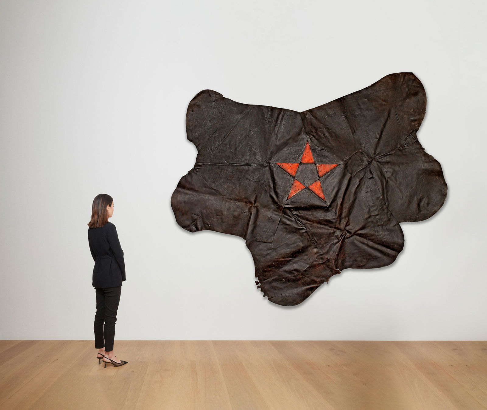 GILBERTO ZORIO (B. 1944) Stella 1982: GILBERTO ZORIO (B. 1944) Stella 1982 signed and dated 82 on the reverse leather and painted wood 244 by 289 cm. 96 1/16 by 113 3/4 in. Footnotes: Provenance Galleria Documen