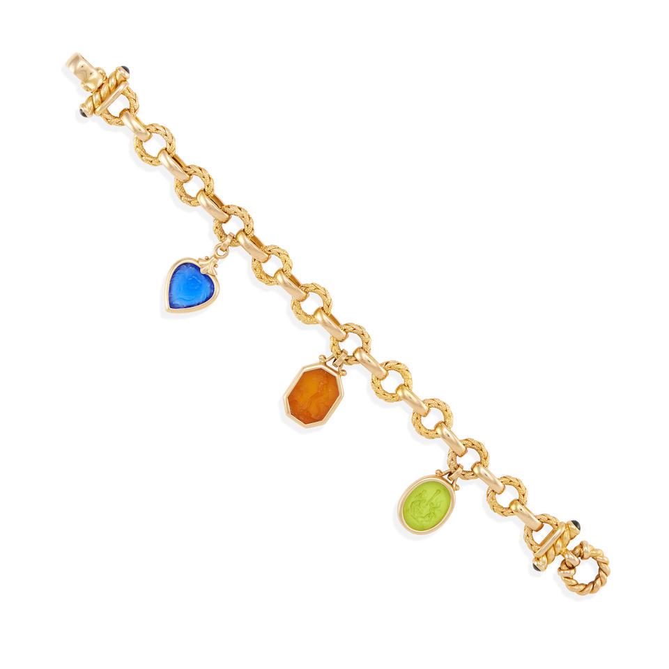 A 14K GOLD AND COLORED GLASS INTAGLIO BRACELET: A 14K GOLD AND COLORED GLASS INTAGLIO BRACELET Colored glass, estimated gross weight 28.4 grams, Italy, length 8 1/4 in. Footnotes: OVERALL CONDITION: Metal stamped and tested for 14k gold; clasp and 