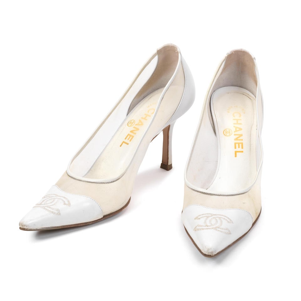 Karl Lagerfeld for Chanel: a Pair of White Mesh Pumps 1990s (includes dust bags and box): Karl Lagerfeld for Chanel: a Pair of White Mesh Pumps 1990s White leather with stitched CC detail to pointed toes and mesh sides Condition Grade C+ Size 38C, includes dust bags and box For further inf