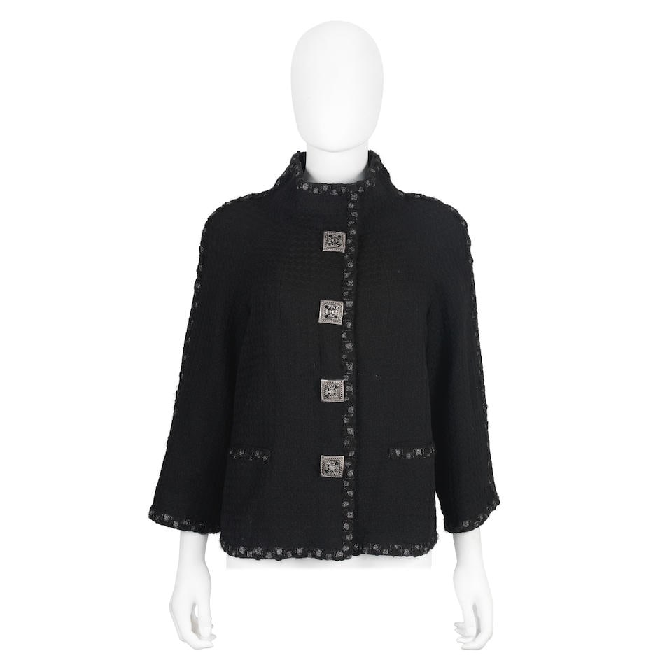 Karl Lagerfeld for Chanel: a Black Tweed Jacket Paris-Dallas Métiers d'Art Collection, Pre-...: Karl Lagerfeld for Chanel: a Black Tweed Jacket Paris-Dallas Métiers d'Art Collection, Pre-Fall 2014 A-line design with bracelet sleeves, in black tweed with metallic silver trim, four large squa