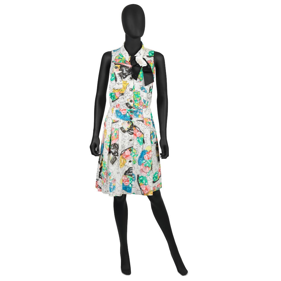 Karl Lagerfeld for Chanel: a Multicolour 'Coco' Cotton Sleeveless Dress Spring 1995: Karl Lagerfeld for Chanel: a Multicolour 'Coco' Cotton Sleeveless Dress Spring 1995 Printed cotton with portraits of Coco Chanel, black and gold CC buttons, together with a camellia pin brooch Conditi