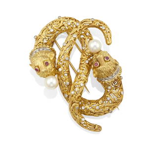 ILIAS LALAOUNIS: AN 18K BI-COLOR GOLD, RUBY, CULTURED PEARL AND DIAMOND BROOCH: ILIAS LALAOUNIS: AN 18K BI-COLOR GOLD, RUBY, CULTURED PEARL AND DIAMOND BROOCH Designed as two chimeras intertwined, eyes set with round rubies, bodies accented by single-cut diamonds, each holding a