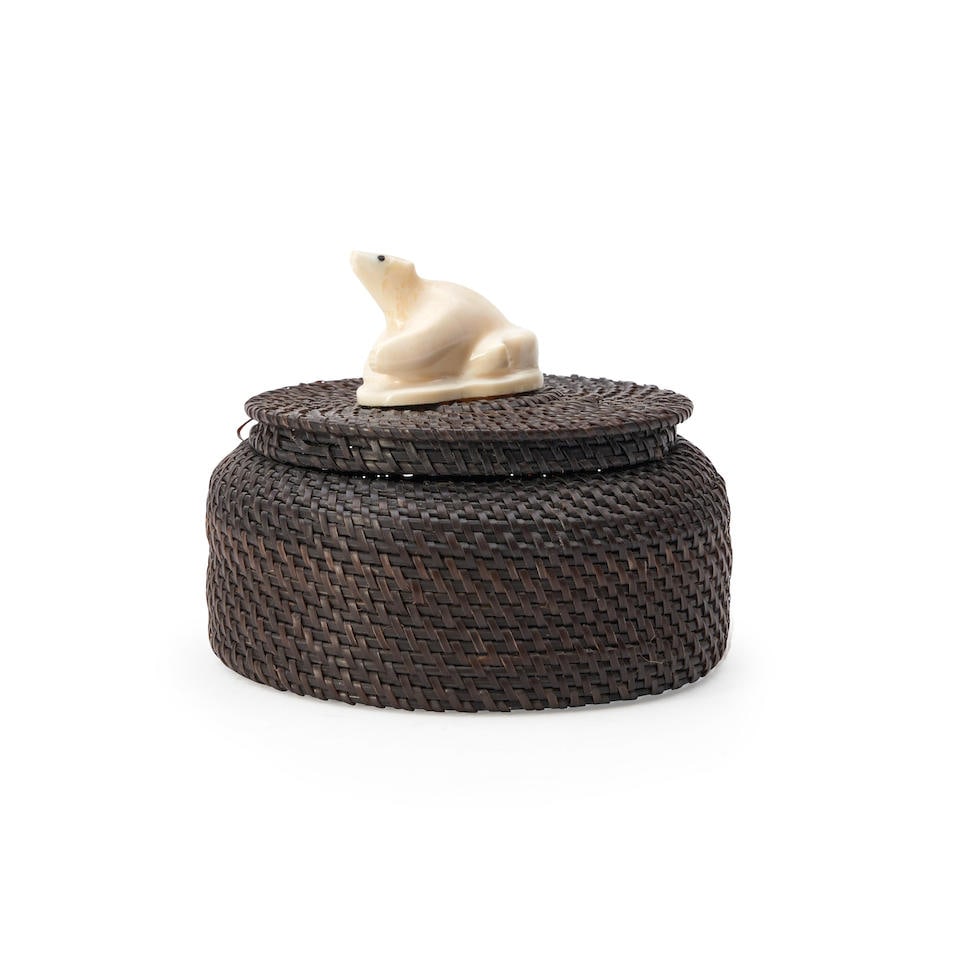 An Eskimo baleen basket Marilyn Hank Otton, (Inupiaq, 20th/21st century) ht. 4 1/4, wd. 4 3/8 in.: An Eskimo baleen basket Marilyn Hank Otton, (Inupiaq, 20th/21st century) Alaska, woven baleen lidded basket, topped with a carved polar bear made from walrus tusk, signed, 'Marilyn Hank 1990.' ht. 4 1