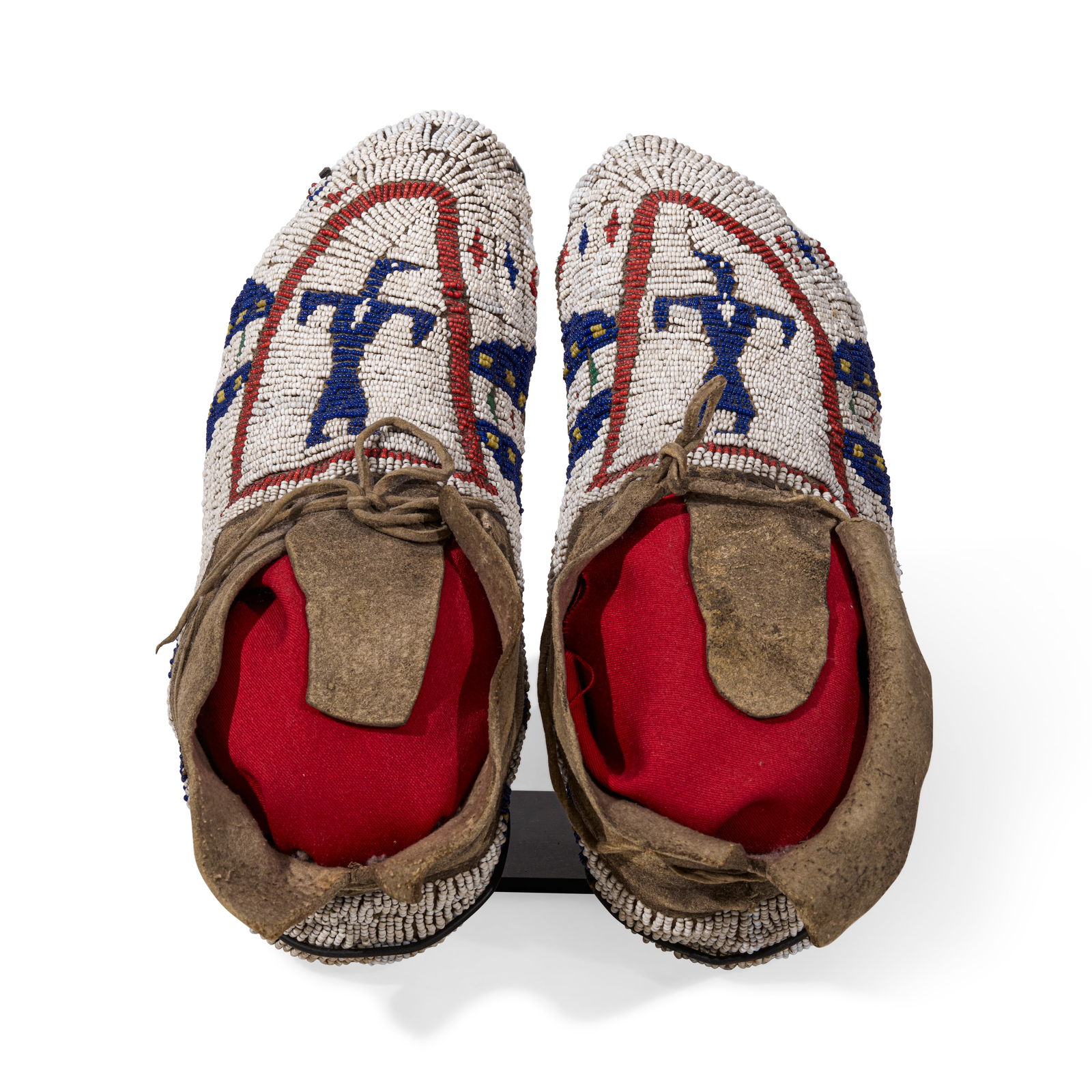 A pair of Plains pictorial beaded moccasins (1 of 3)