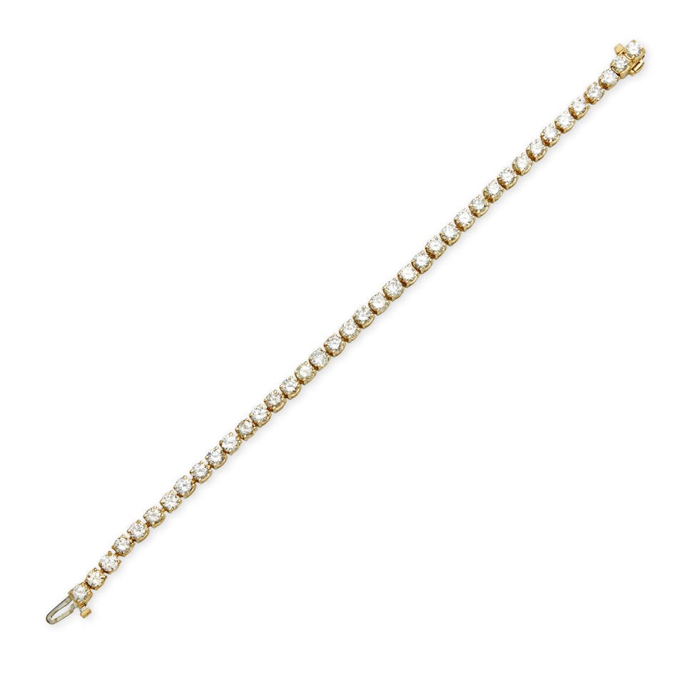 A 14K GOLD AND DIAMOND LINE BRACELET (1 of 3)