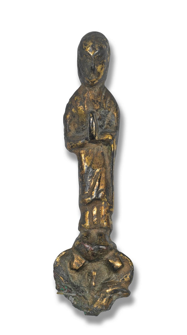 A GILT-BRONZE STANDING FIGURE OF A LUOHAN 14th century or earlier (1 of 1)