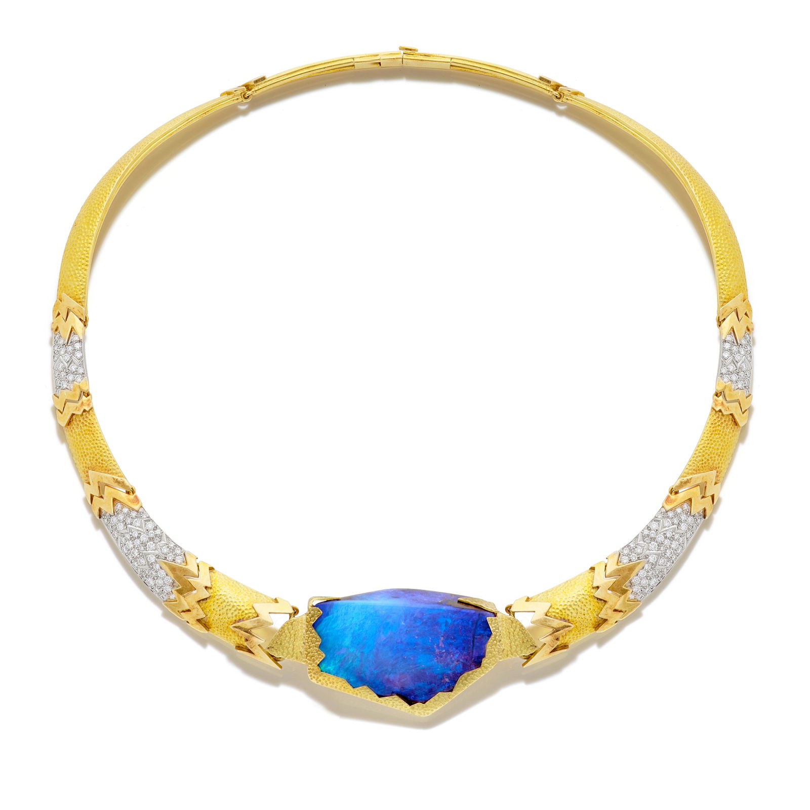 GRIMA: BOULDER OPAL AND DIAMOND NECKLACE, CIRCA 1985: GRIMA: BOULDER OPAL AND DIAMOND NECKLACE, CIRCA 1985 The textured articulated collar with central boulder opal, highlighted by polished and brilliant-cut diamond zig-zag motifs, signed Grima, diamond
