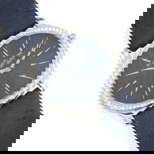 PATEK PHILIPPE: AN 18K WHITE GOLD AND DIAMOND 'CALATRAVA' WATCH: PATEK PHILIPPE: AN 18K WHITE GOLD AND DIAMOND 'CALATRAVA' WATCH Designed with a manual movement, round blue dial with baton hour makers, encircled by round diamonds weighing approximately 0.50 carat,