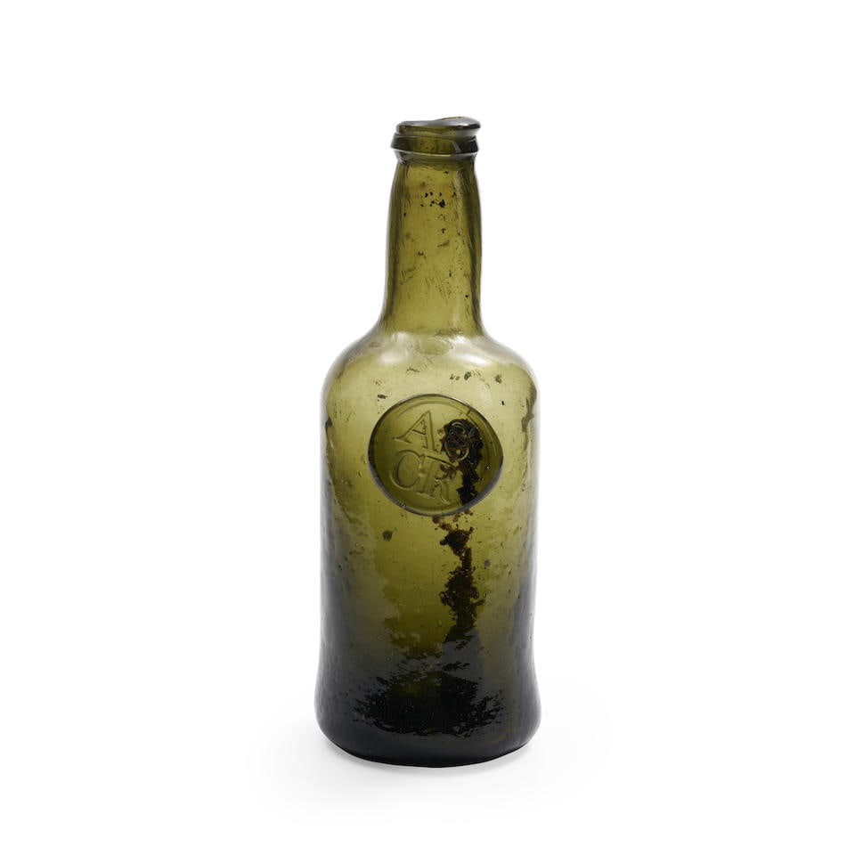 A Sealed Half Size 'Cylinder' Wine Bottle, Late 18th Century,: A Sealed Half Size 'Cylinder' Wine Bottle, Late 18th Century, of olive-green tint, the narrow body with a long straight neck and string rim, applied just below the shoulder with a seal inscribed 'A.S/