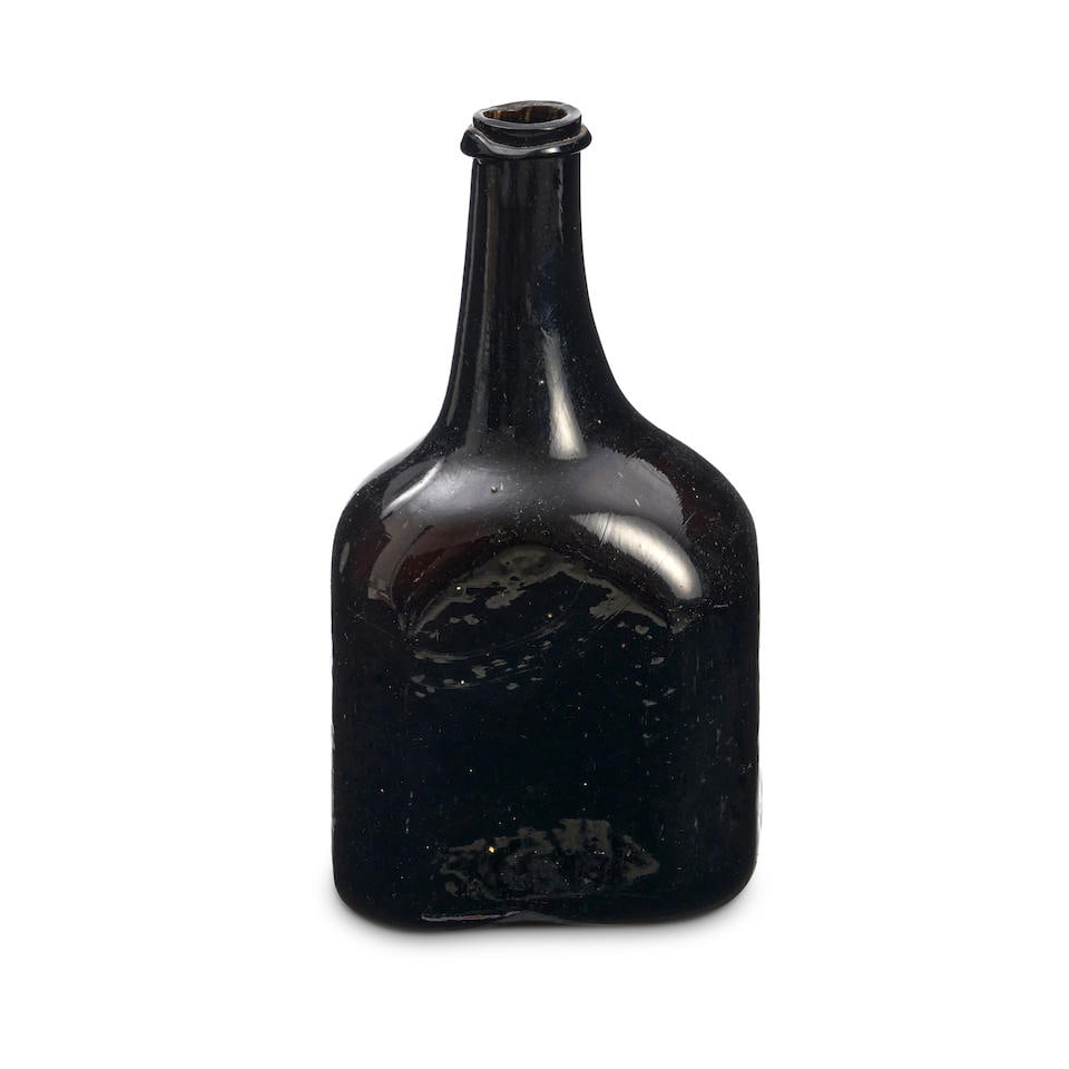 A Half Size 'Rectangular Octagonal Cylinder' Wine Bottle, circa 1740-45,: A Half Size 'Rectangular Octagonal Cylinder' Wine Bottle, circa 1740-45, of dark olive-green tint, the straight-sided octagonal body with a long slender neck and applied string rim, with a very shallo