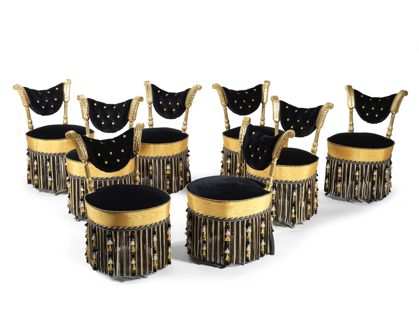 A matched set of eight French giltwood and ebonised salon chaises or drawing room chairs four ch...: A matched set of eight French giltwood and ebonised salon chaises or drawing room chairs four chairs late 19th century, the other four chairs apparently later Each with ring turned fluted and foliate