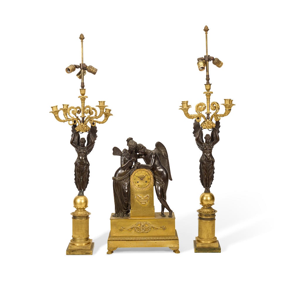 AN ASSEMBLED GILT AND PATINATED BRONZE THREE-PIECE CLOCK GARNITURELate 19th/early 20th century (1 of 1)