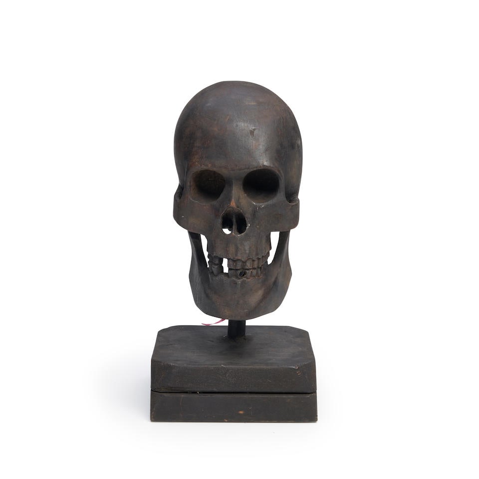 Carved and Black-painted Skull, 20th century. (1 of 3)